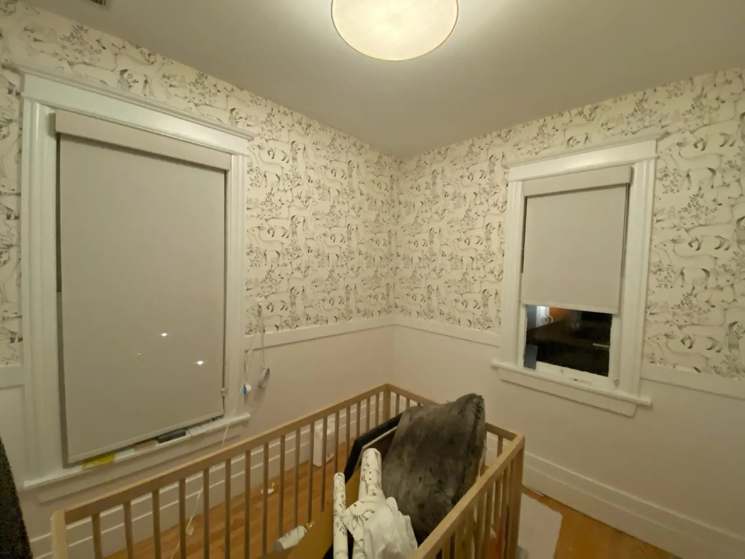Soft patterned wallpaper in a bright nursery